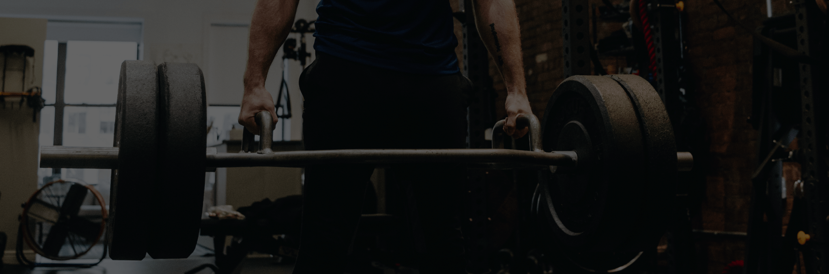 A man lifting a barbell weight